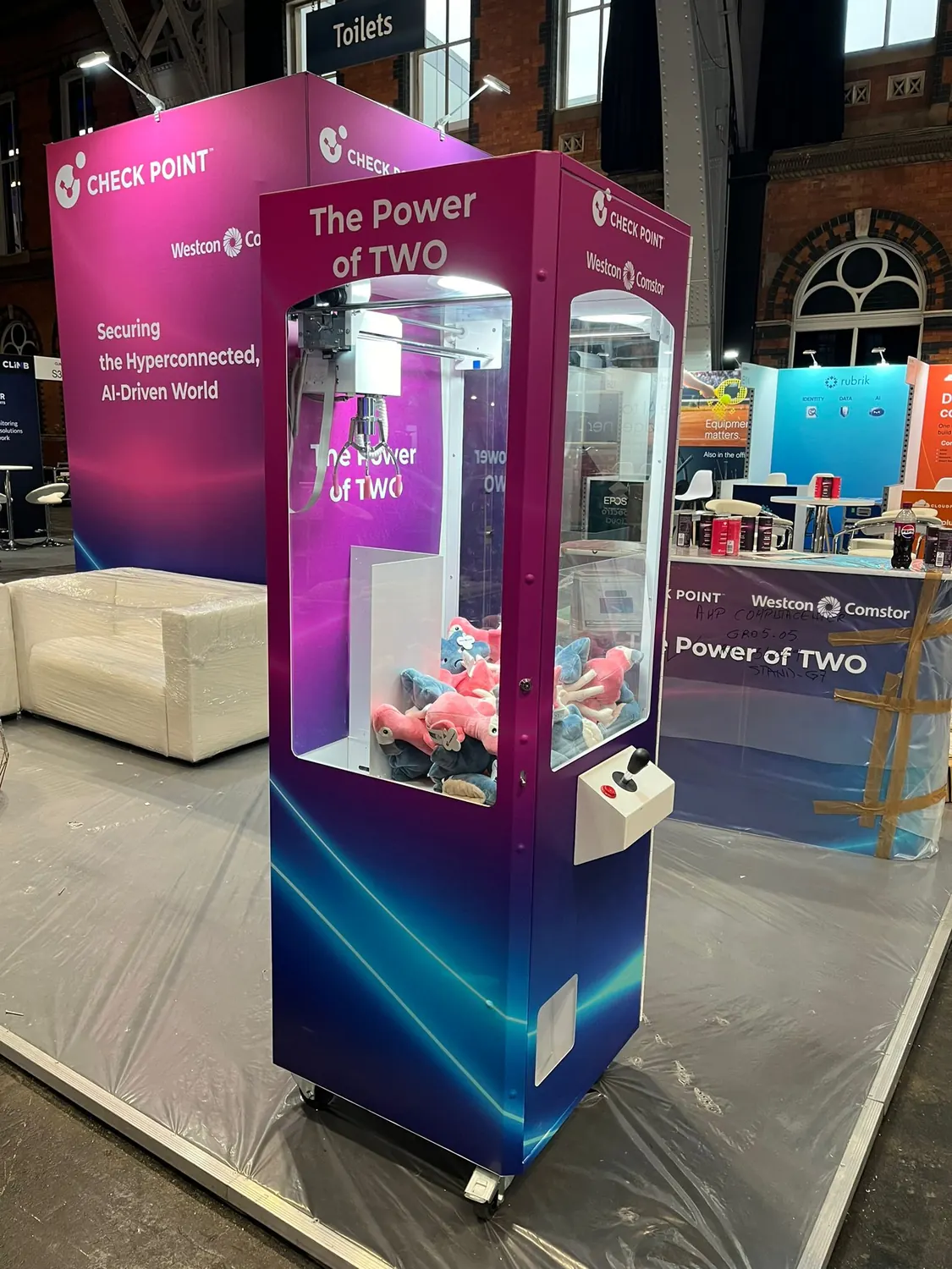 Branded prize crane at a tech exhibition